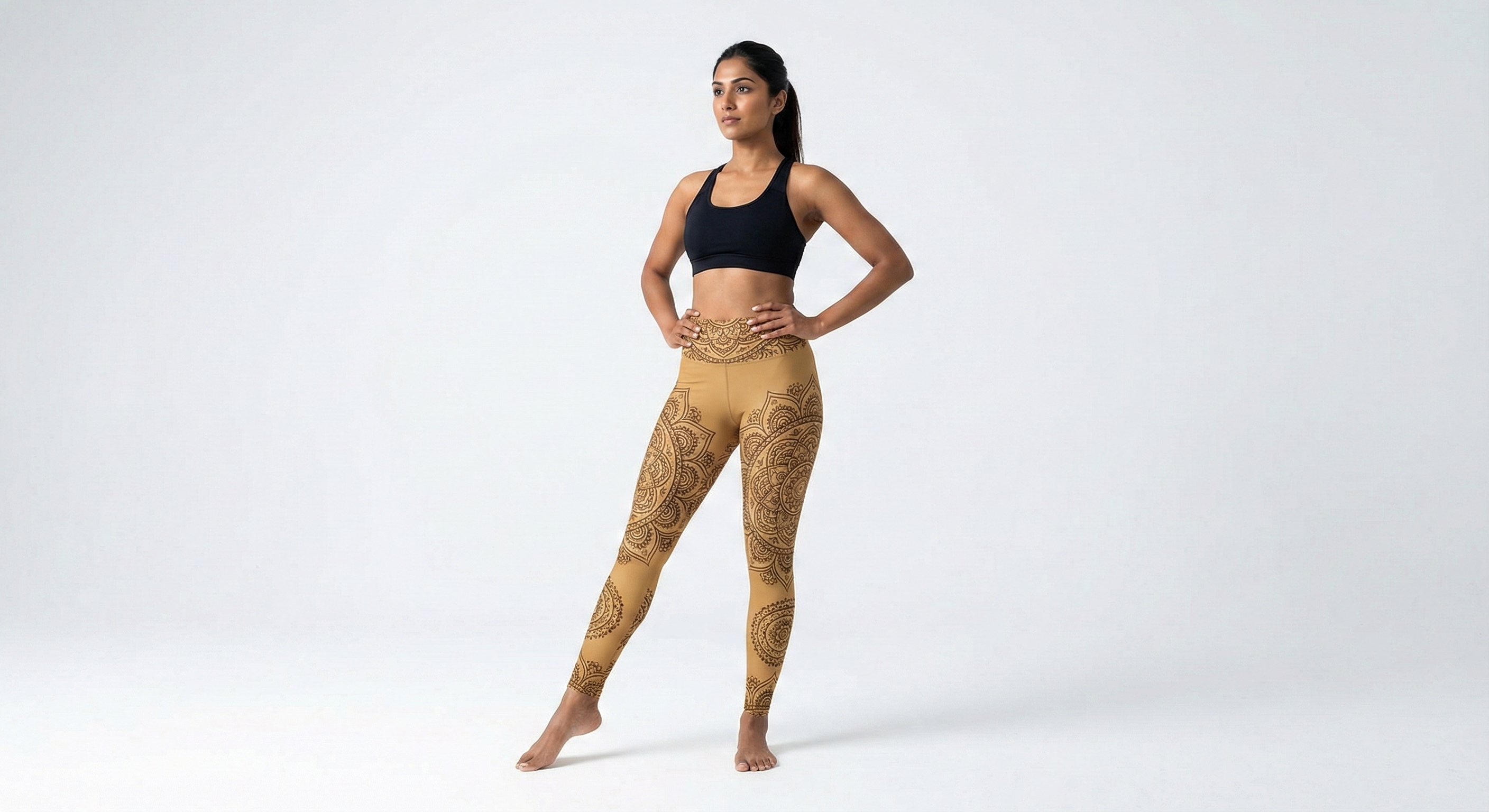 Woman in mandala pattern leggings in studio